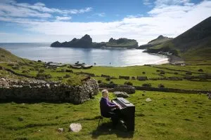 Photograph: Times photographer James Glossop Composer Sir James MacMillan plays songs from the album “The Lost Songs of St Kilda” on the island, which is 64 kilometres west-northwest of North Uist in the North Atlantic Ocean. Info from press release: “For the first time ever, we can hear the music of St Kilda – magical, melancholic folk tunes feared lost since the Scottish island dubbed ‘the Edge of the World’ was evacuated in 1930. ‘The Lost Songs of St. Kilda’ have been brought back to life on a unique new album thanks to a 73-year-old retired teacher in an Edinburgh care home, and today’s leading Scottish composers including Sir James Macmillan, Craig Armstrong, Francis Macdonald and Christopher Duncan. This new album offers a last link to life on St Kilda, the most remote spot in the British Isles (about 40 miles west of the Outer Hebrides off Scotland’s north-west coast), once home to a small community of intrepid islanders who climbed its cliffs and crags in search of food. Their folk songs were passed down from generation to generation, but have never been heard by the wider world… until now." 04-09-16